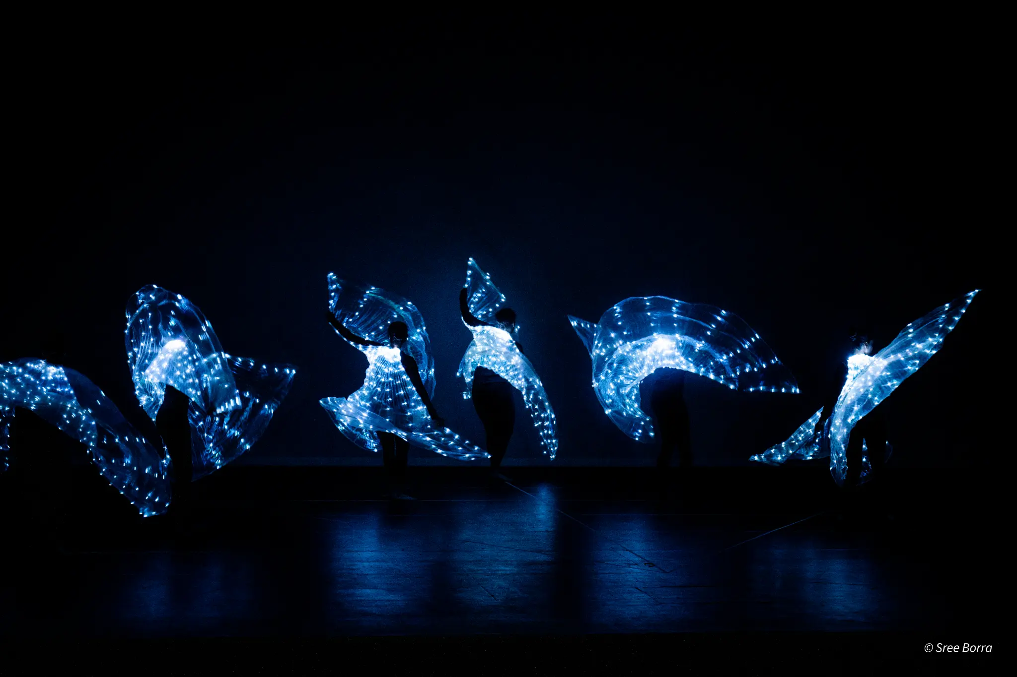 Illuminated live performers at a Melbourne event photographed by The Circle Studio