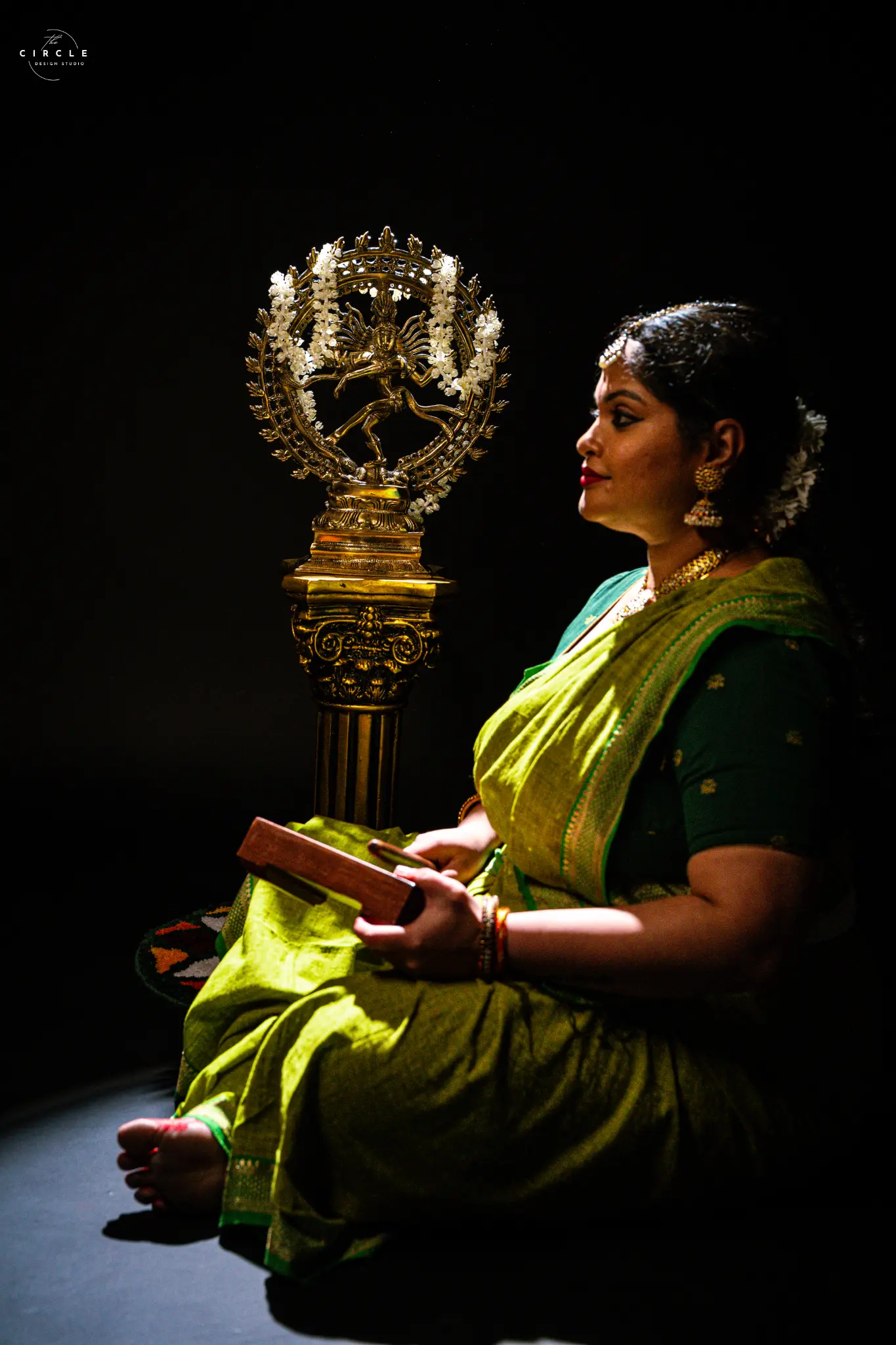 Cultural portrait in dramatic stage light photographed by The Circle Studio