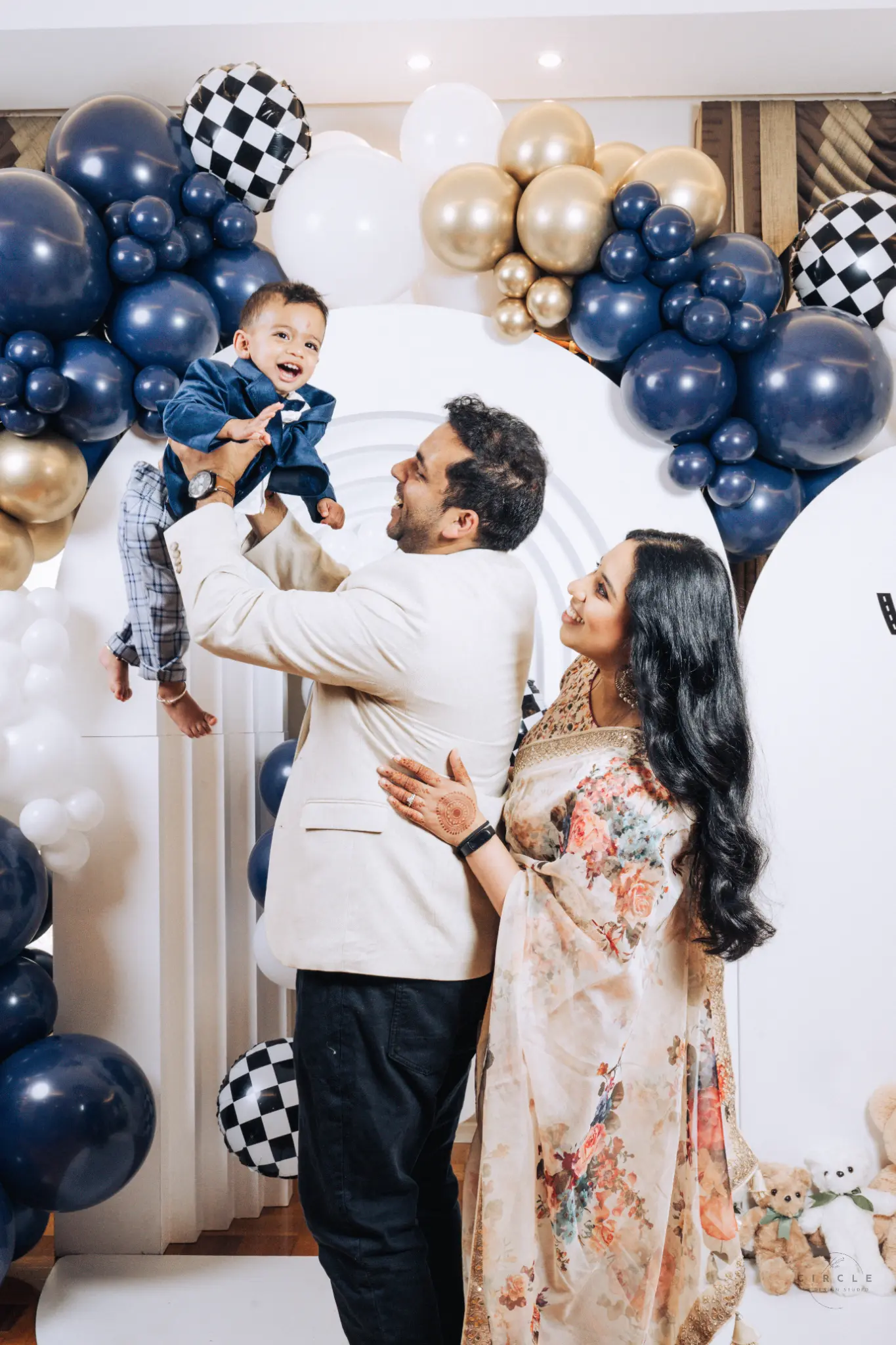 Family sharing a candid moment at a celebration photographed by The Circle Studio