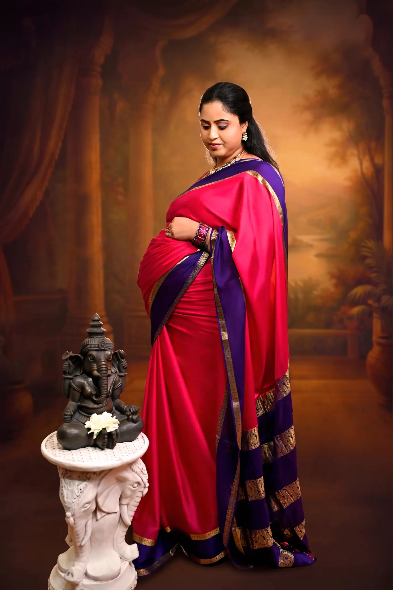 Maternity portrait in a red sari photographed by The Circle Studio
